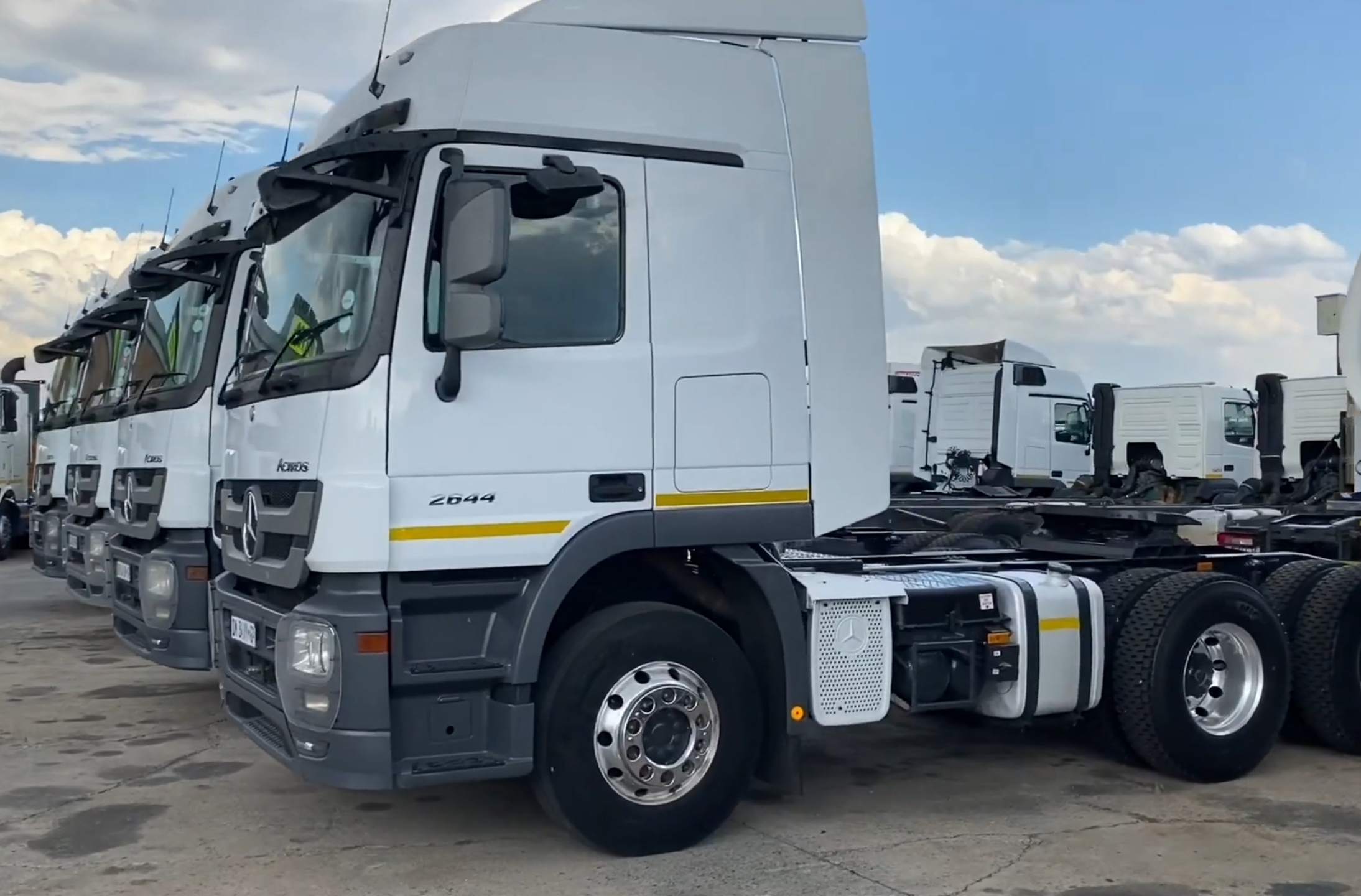 Fleet of trucks parked at a depot